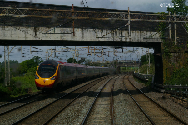 Pendolino speeding past the Bletchley train