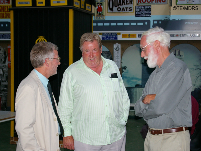 Chairman, President and guest share a joke